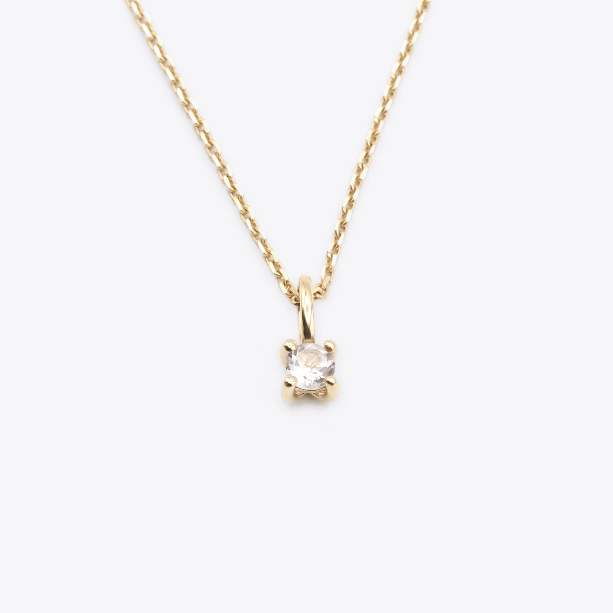 14k gold april birthstone necklace with white topaz by narrae